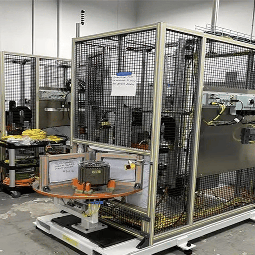 Example of a custom test machine with a part in it on a manufacturing background