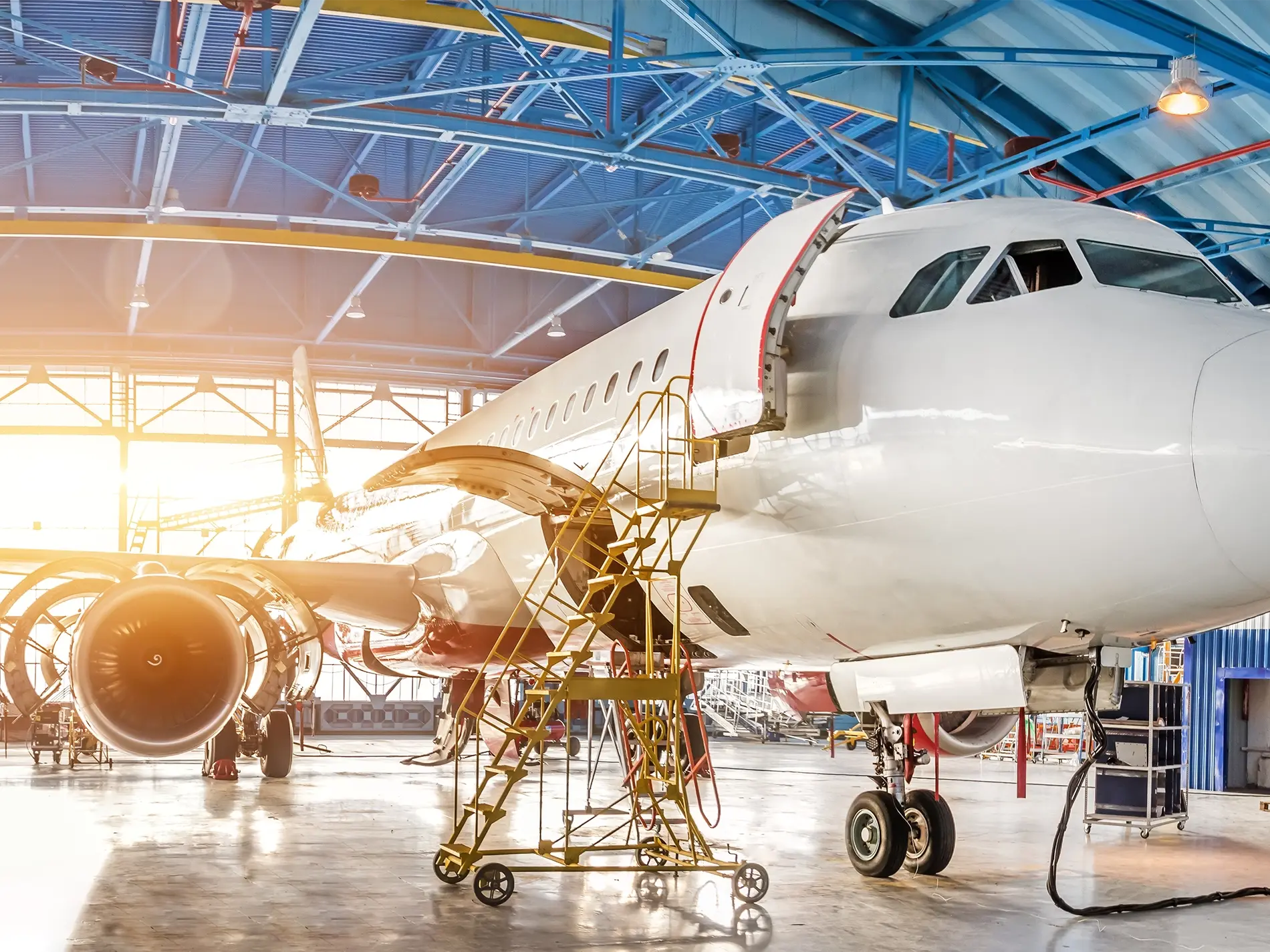 Airplane in hangar undergoing repairs