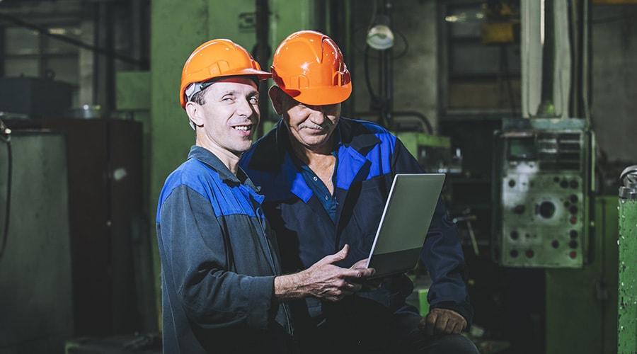 Two application engineers on a factory floor