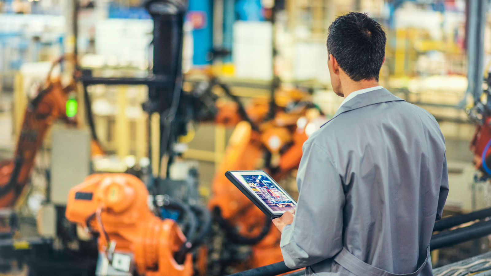 engineer looking over factory floor