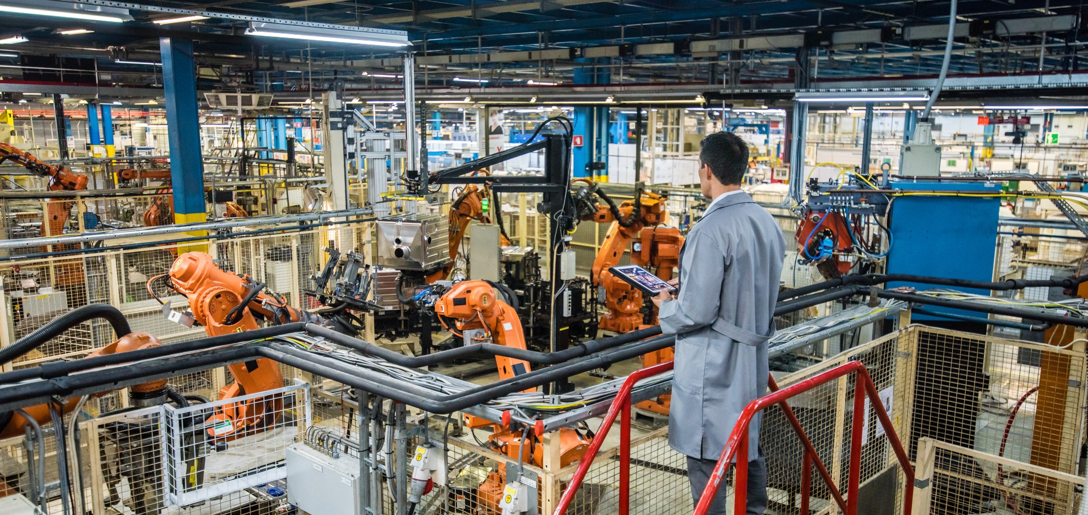 manager looking over production floor 